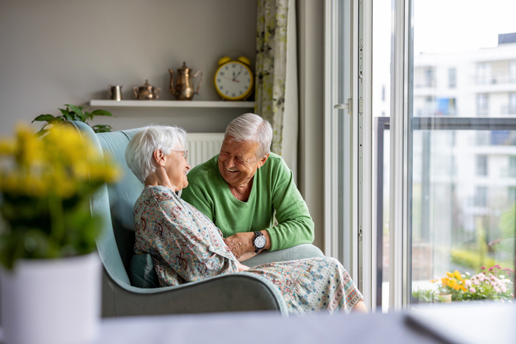 Elderly couple laughing and enjoying a funny moment at Trinity Hills Estates in Arcadia, CA.